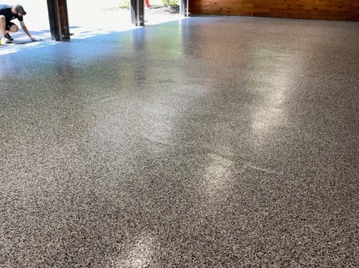 Newly installed epoxy garage flooring for a durable and modern finish Newly installed epoxy garage flooring for a durable and modern finish